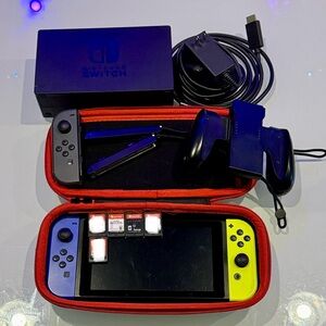 Nintendo Switch with Blue and Yellow Joy-Con some items sold